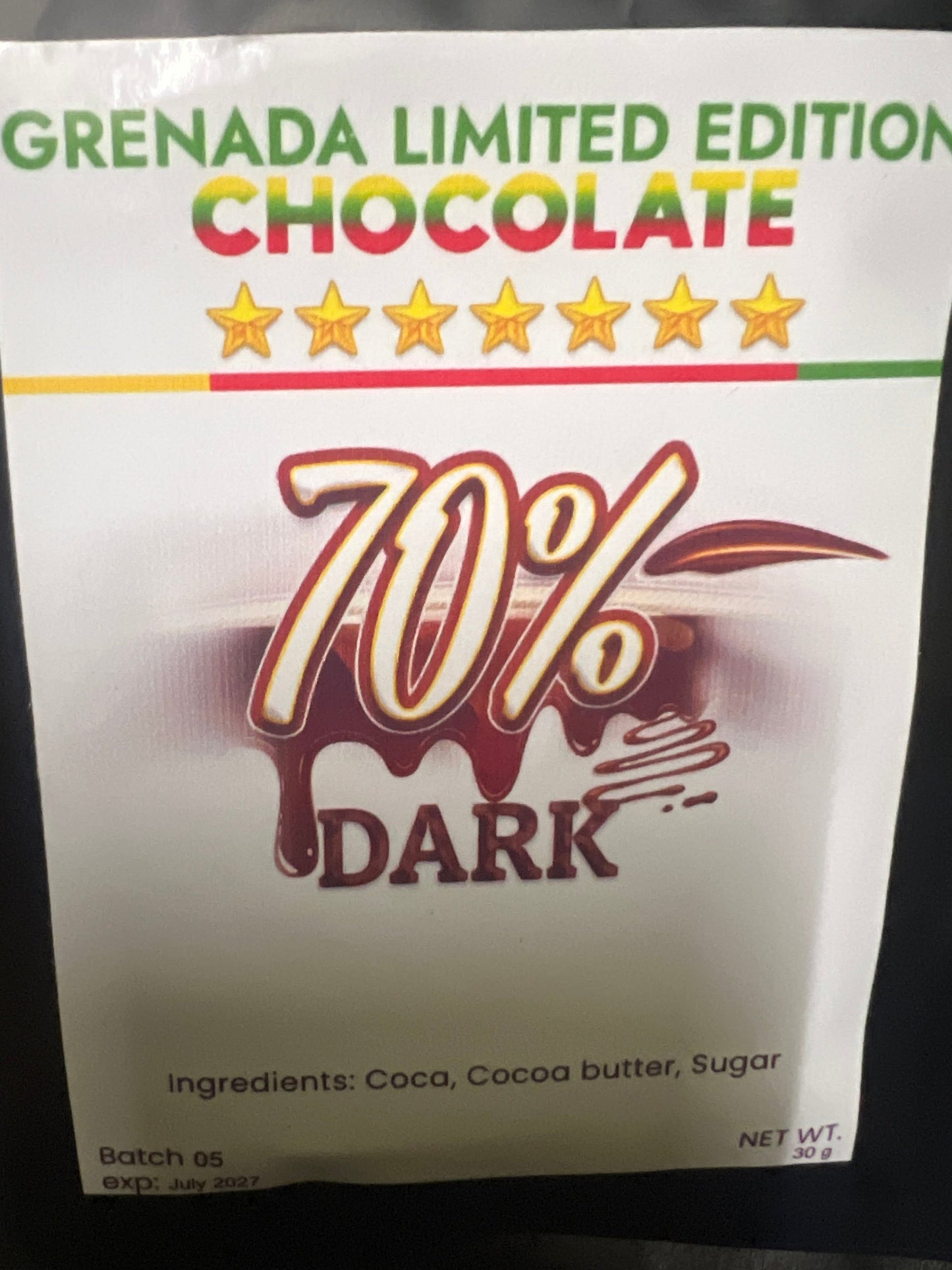 70% Dark Grenada Limited Edition Chocolate packaging on a dark background